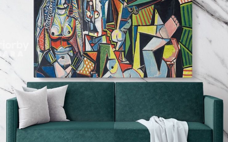 Modern living room with green sofa and white pillows, featuring Picasso’s Cubist Art painting print displayed on the marble wall.