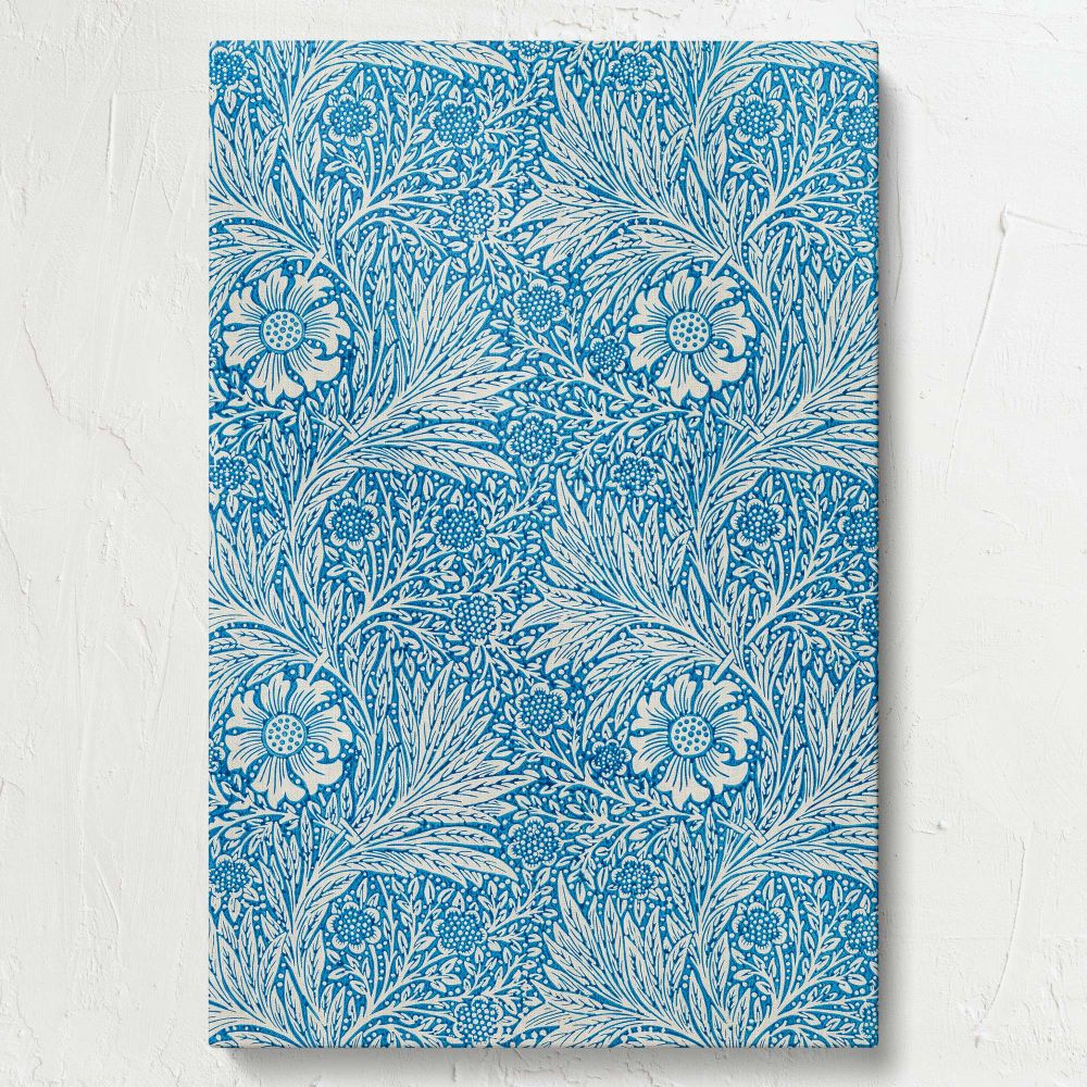 William Morris's Marigold pattern from 1875 presenting a beautiful combination of blue and white floral motifs, perfect for art lovers and home decorators looking for a timeless vintage piece to enhance their walls with elegance and history.