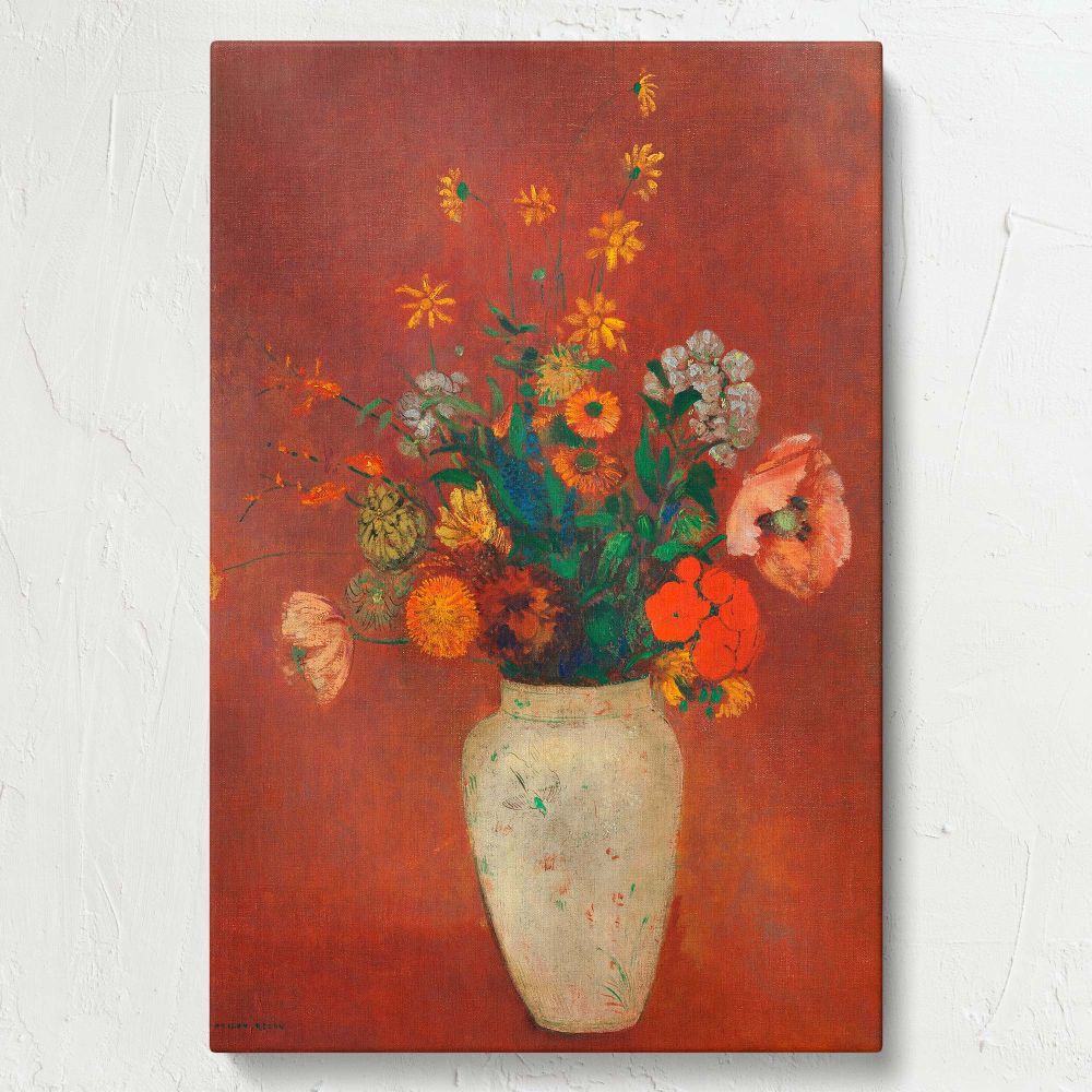 A timeless floral still life by Odilon Redon featuring a white Chinese vase holding an explosion of colorful wildflowers, including orange poppies and yellow daisies, all painted on a striking red background with detailed textures and artistic depth.
