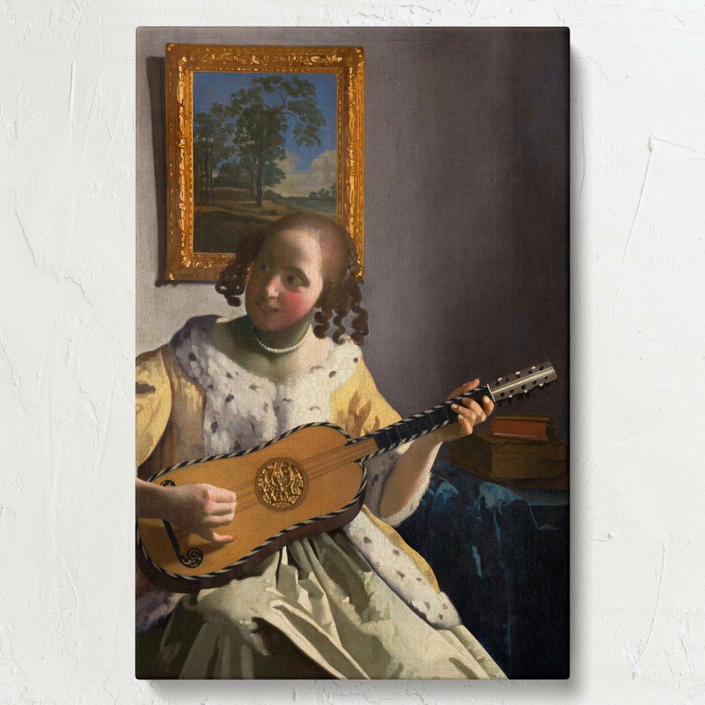 Captivating wall art canvas of The Guitar Player by Vermeer showing a young woman playing a guitar in a softly lit room, her fur-trimmed yellow dress and the guitar's golden details glowing gently under the natural light streaming into the space.