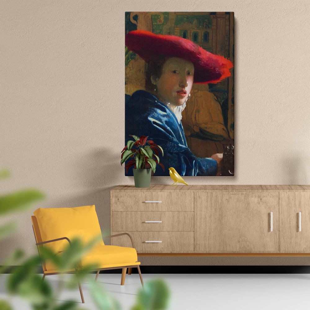 Decorative wall art of Girl with the Red Hat by Vermeer showcasing a striking young woman in a red hat, dressed in a luxurious blue shawl, with soft light and intricate details creating a timeless and elegant addition to home decor.
