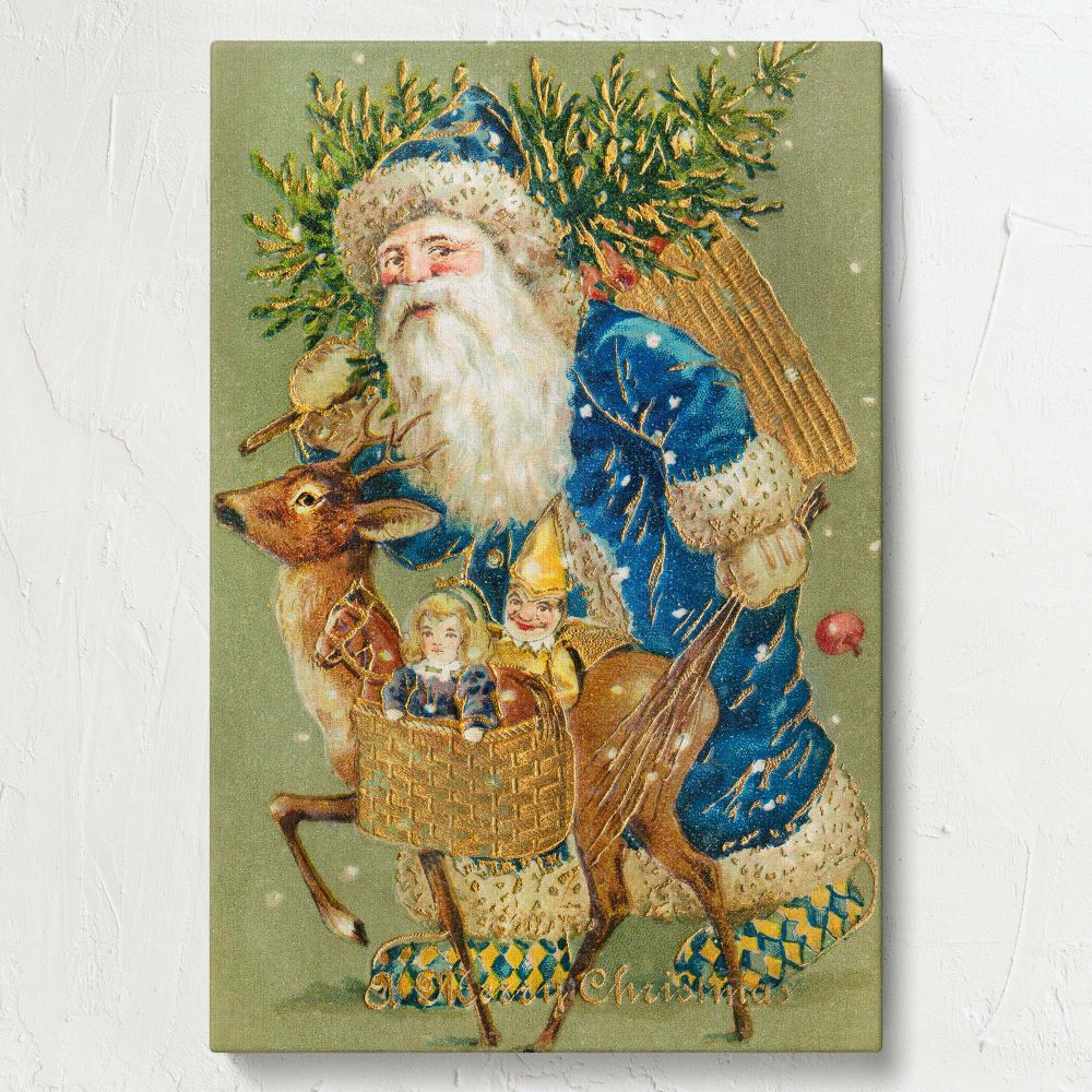A Merry Christmas ca 1900s canvas showing Santa Claus in a royal blue coat with toys and evergreens walking beside a reindeer in the snow, offering a festive vintage decor piece for elegant and nostalgic holiday interiors.