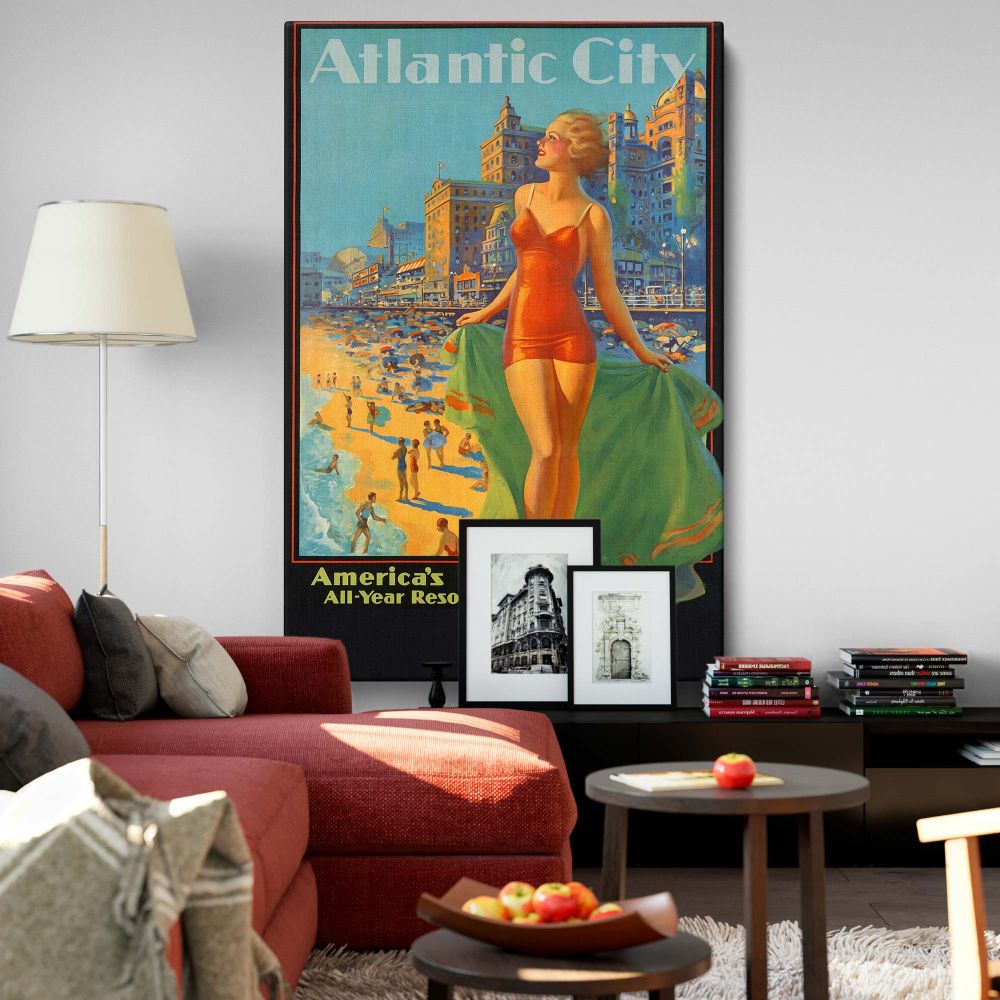 Atlantic City vintage tourism poster reproduced on a wall canvas featuring a glamorous woman in a red swimsuit standing on the beach, surrounded by colorful umbrellas, bustling beachgoers, and an iconic boardwalk with vibrant retro travel aesthetics.