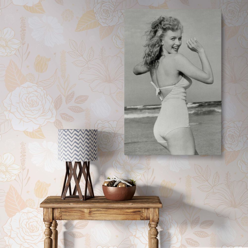 Marilyn Monroe smiling on the beech in a classic bikini captured in black and white canvas print perfect for bedroom wall decor or gift for her.
