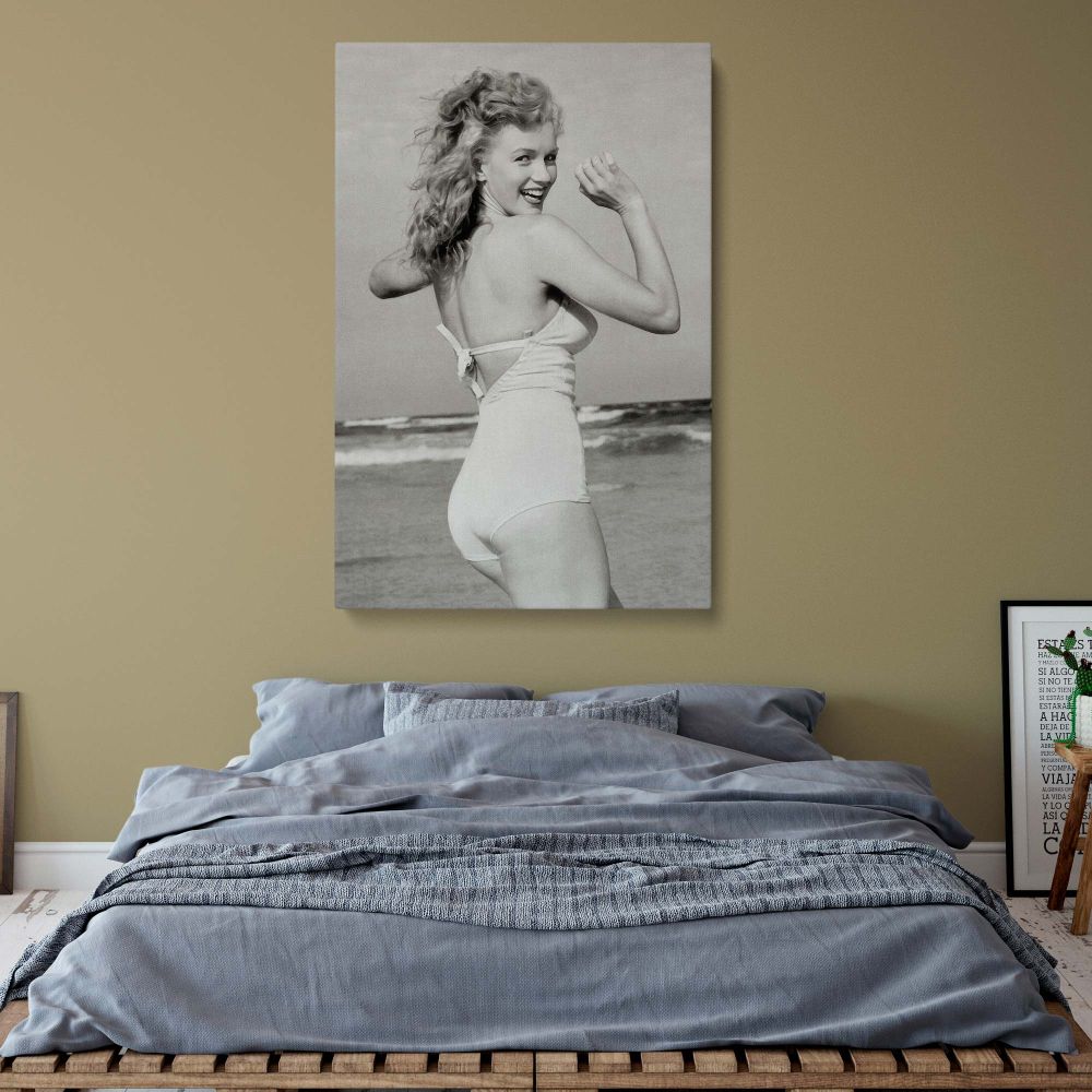 Nude portrait inspired black and white canvas print of Marilyn Monroe in beach setting adds elegant and trendy touch to any living space.