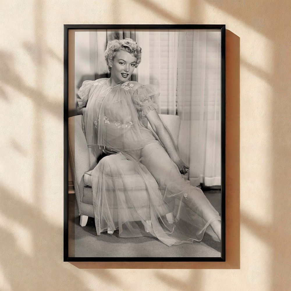 Elegant black and white canvas wall art of Marilyn Monroe posing in a translucent gown radiating old Hollywood glamour and making a striking addition to vintage wall art collections or classic interiors designed for elegant woman decor themes.