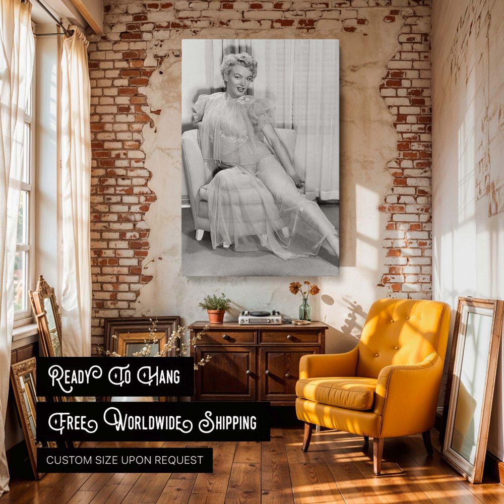 Vintage glamour photo print of Marilyn Monroe in a soft flowing sheer dress elegantly seated with confident expression transformed into a high-quality canvas wall art perfect for classic movie fans and elegant woman decor collectors.