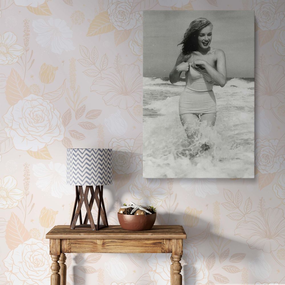 Marilyn Monroe framed canvas print featuring the Hollywood icon posing at Tobay Beach. This black and white wall art adds vintage glamour to any space, making it a perfect decor piece for homes, offices, or galleries. A must-have for Marilyn Monroe fans a