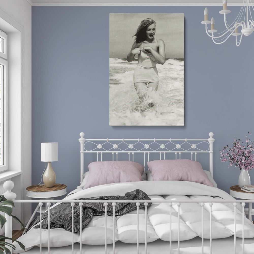 Classic Marilyn Monroe wall art featuring a stunning beachside portrait of the Hollywood star. This black and white framed canvas print adds sophistication to any room. A perfect gift for Marilyn Monroe fans, art lovers, or those who appreciate vintage gl