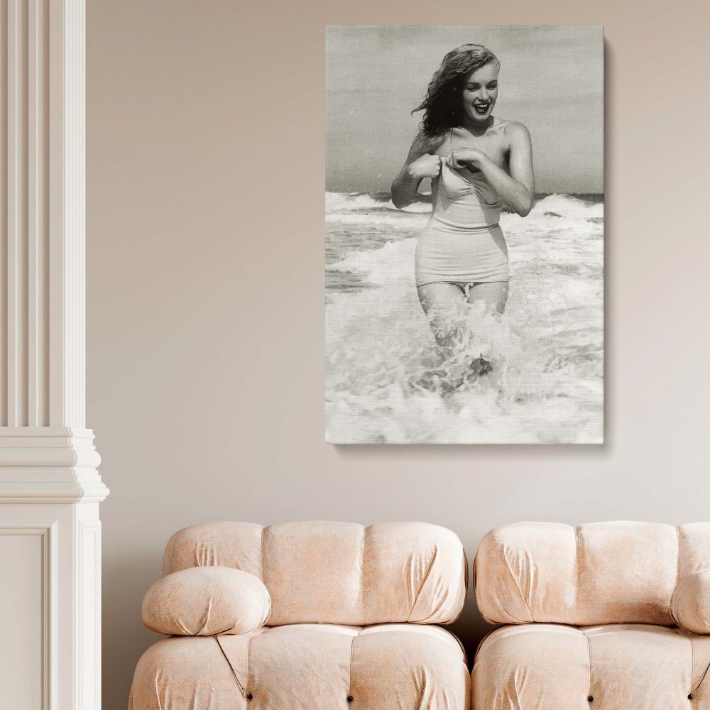 Timeless Marilyn Monroe canvas print capturing the beloved actress in a striking pose at Tobay Beach. This framed wall art is perfect for home or office decor. Printed on high-quality canvas with fade-resistant inks, this elegant artwork is a must-have fo