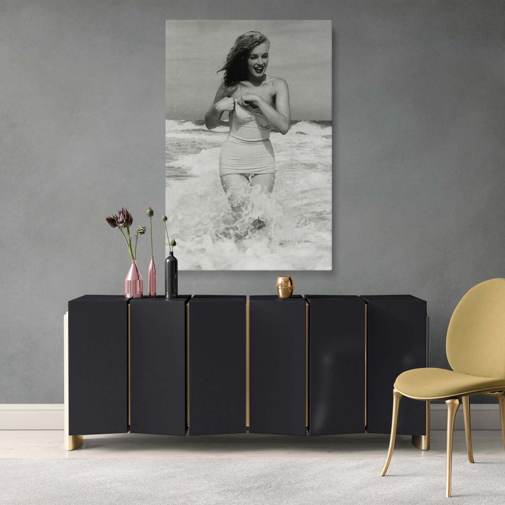 Vintage Marilyn Monroe canvas print showcasing the iconic actress at Tobay Beach. This framed wall art print is ideal for fans of classic Hollywood and elegant decor. Made with premium materials, this Monroe artwork is a sophisticated statement piece for 