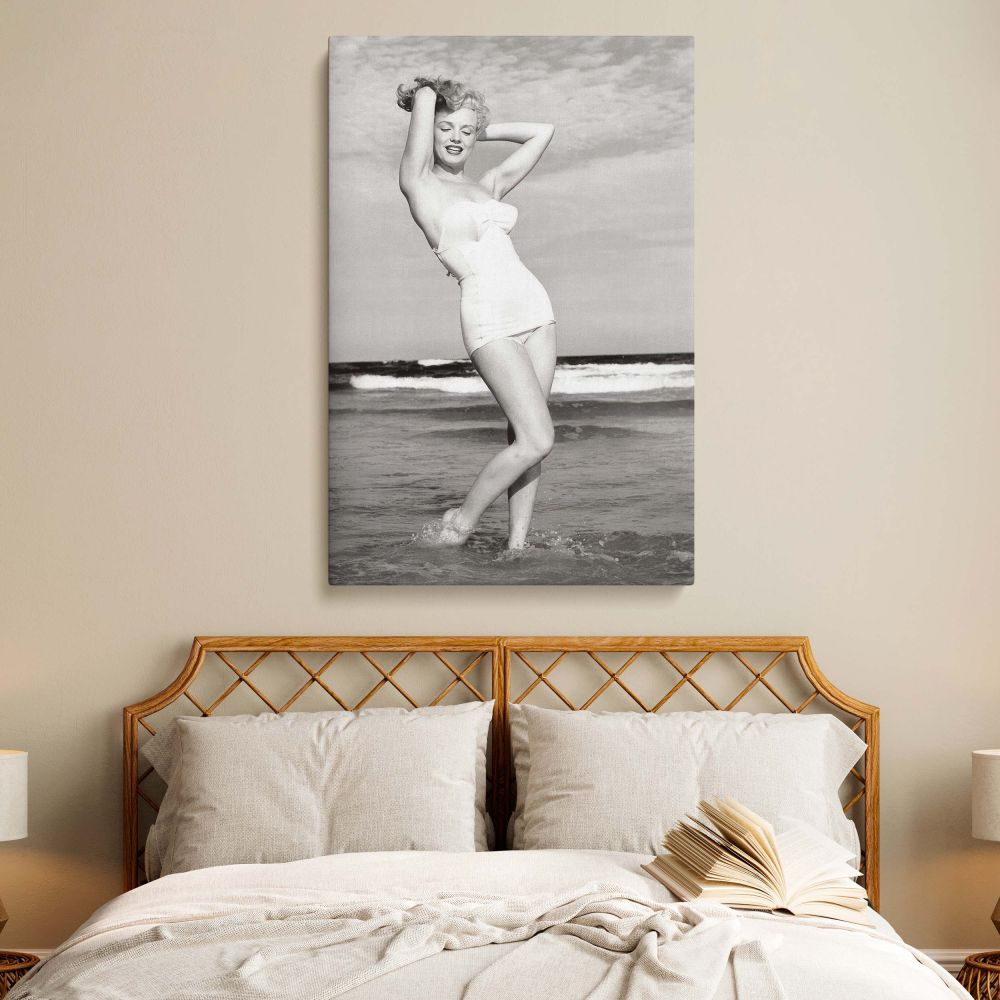 Vintage-style canvas wall art showing Marilyn Monroe in a bikini on the beach, ideal as a gift for her or a stylish home decor piece.