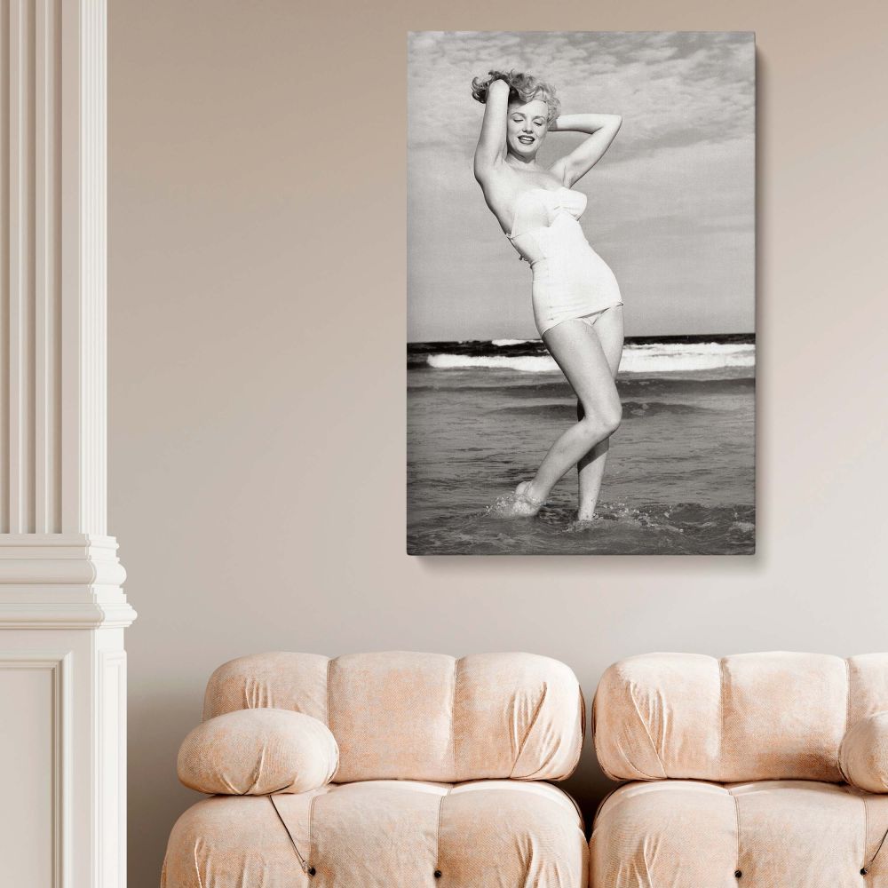 Artistic canvas print of Marilyn Monroe in a timeless beachside pose, wearing a strapless bikini, celebrating her role as a cultural icon.