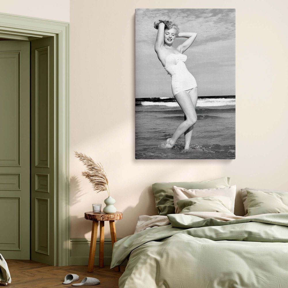 Beautiful beach scene featuring Marilyn Monroe in a black and white swimsuit photo, printed on premium canvas, ready for wall mounting.
