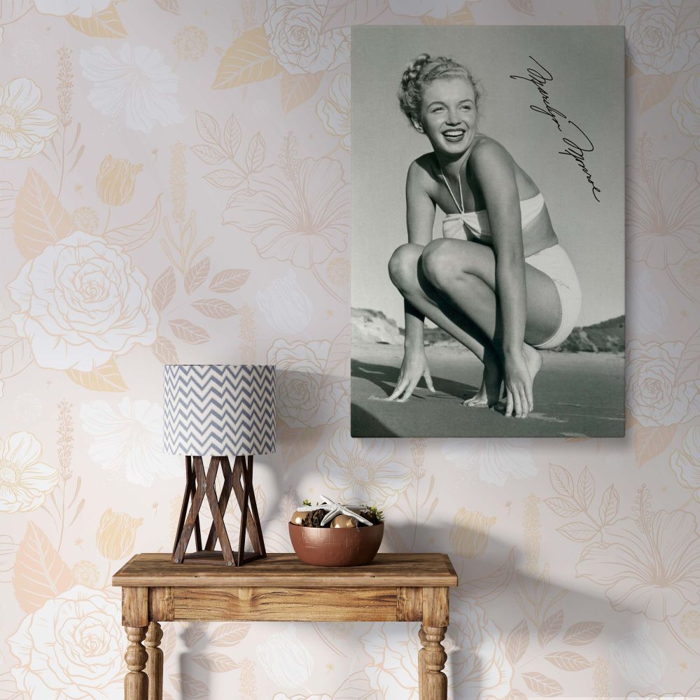 Marilyn Monroe framed canvas print featuring a stunning beachside bikini pose. A perfect wall art piece for home decor, adding vintage Hollywood glamour to any space. Ideal for fans of classic cinema and Marilyn's timeless beauty.
