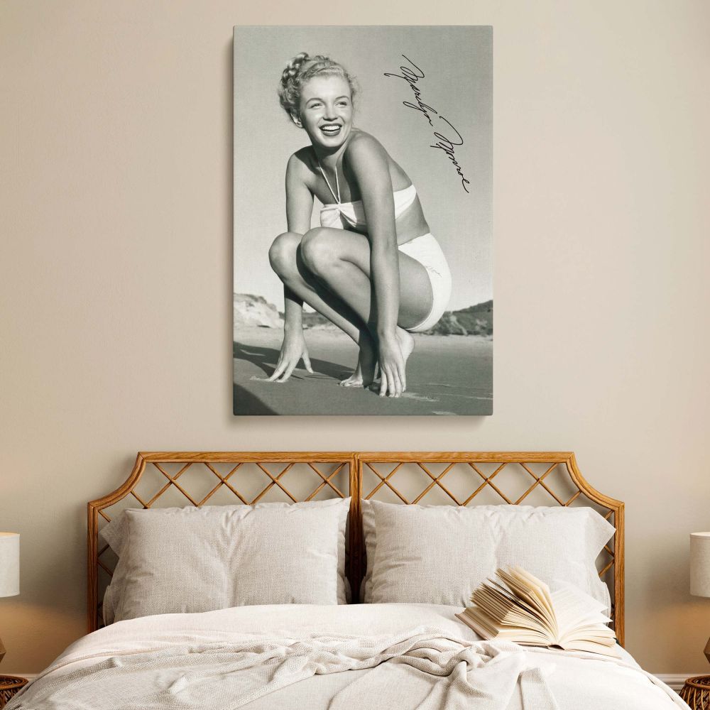 Beautiful Marilyn Monroe model canvas print featuring her in a sexy bikini pose on the beach. This stylish framed wall art enhances home decor and makes a great gift for her. A timeless tribute to Hollywood's golden age.