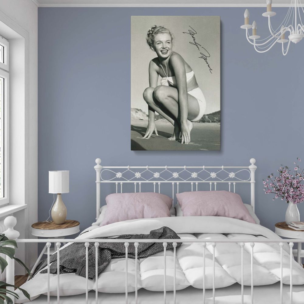 Vintage-inspired Marilyn Monroe print capturing her iconic beauty in a glamorous beach photoshoot. This framed canvas wall hanging is perfect for retro decor lovers, classic film enthusiasts, and Marilyn admirers.