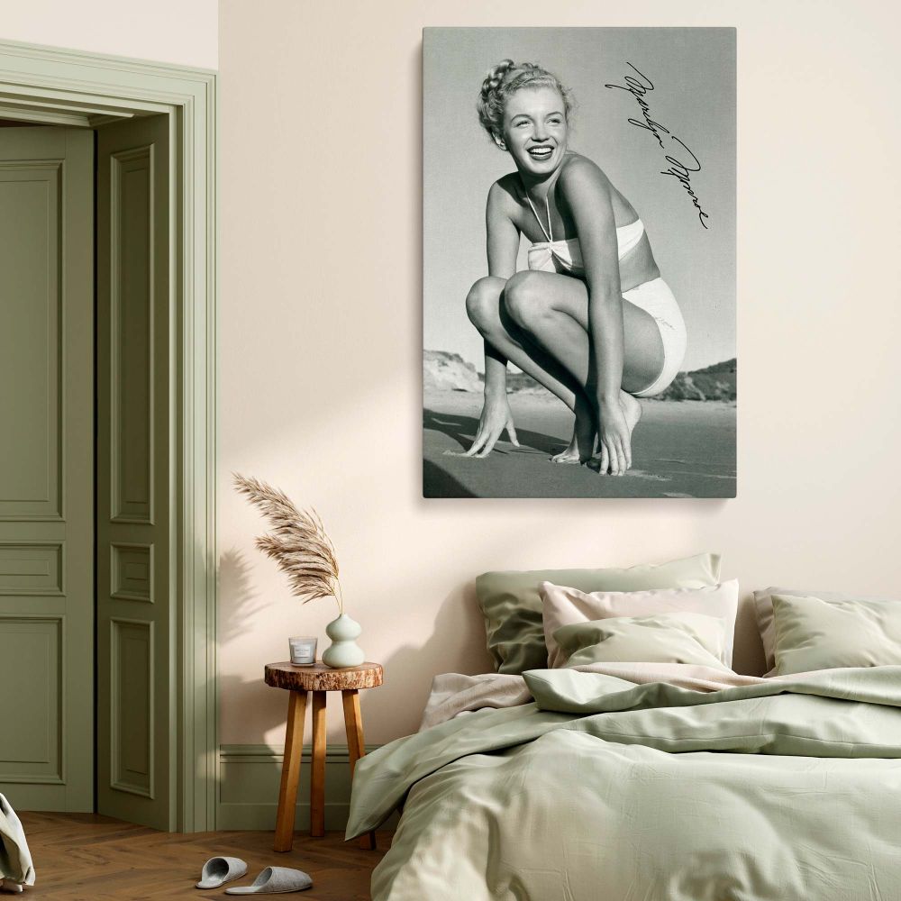 Timeless Marilyn Monroe poster printed on high-quality framed canvas. A gorgeous wall art piece featuring the legendary actress in a classic beach pose, perfect for stylish home decor and vintage Hollywood lovers.