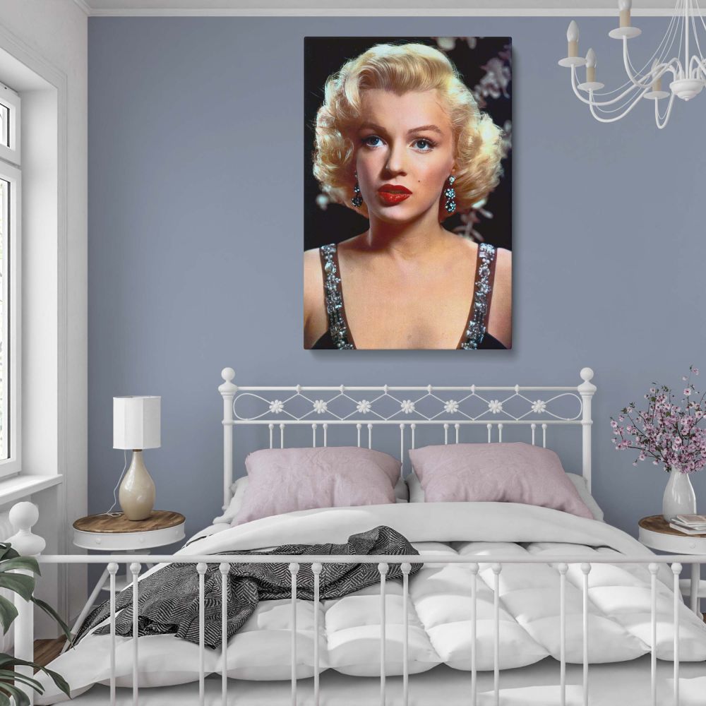In this Marilyn Monroe glamorous close up portrait, she radiates confidence, poise, and timeless glamour. The deep red lipstick, dazzling earrings, and stunning gown neckline all contribute to a powerful visual statement. This vintage Hollywood photo canv