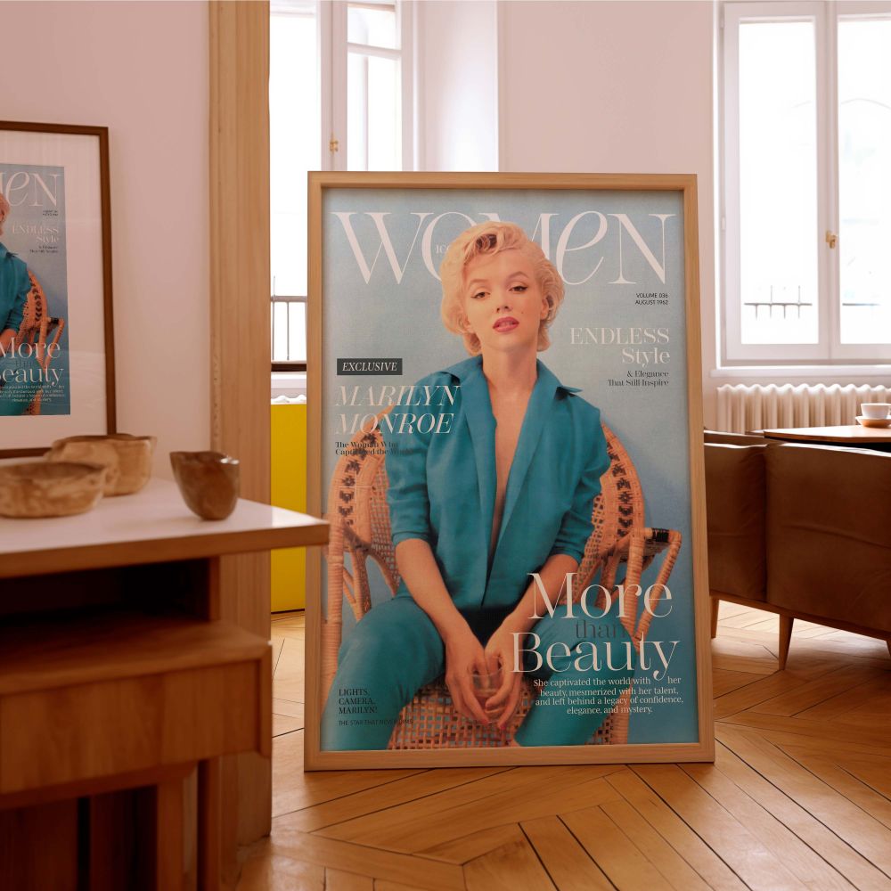 Marilyn Monroe seated in a woven chair wearing a bold blue pantsuit with magazine-style text overlays creating a dramatic fashion poster that blends old Hollywood glam vintage wall decor and powerful woman imagery into one iconic tribute to a beloved scre