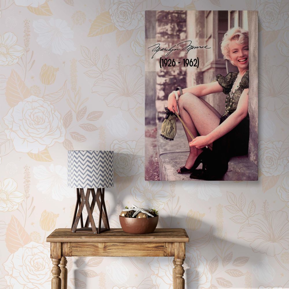 Marilyn Monroe sitting on a stone step in a lace puff sleeve blouse and fishnet stockings photographed by Milton Greene in 1956 as a vintage canvas wall art.