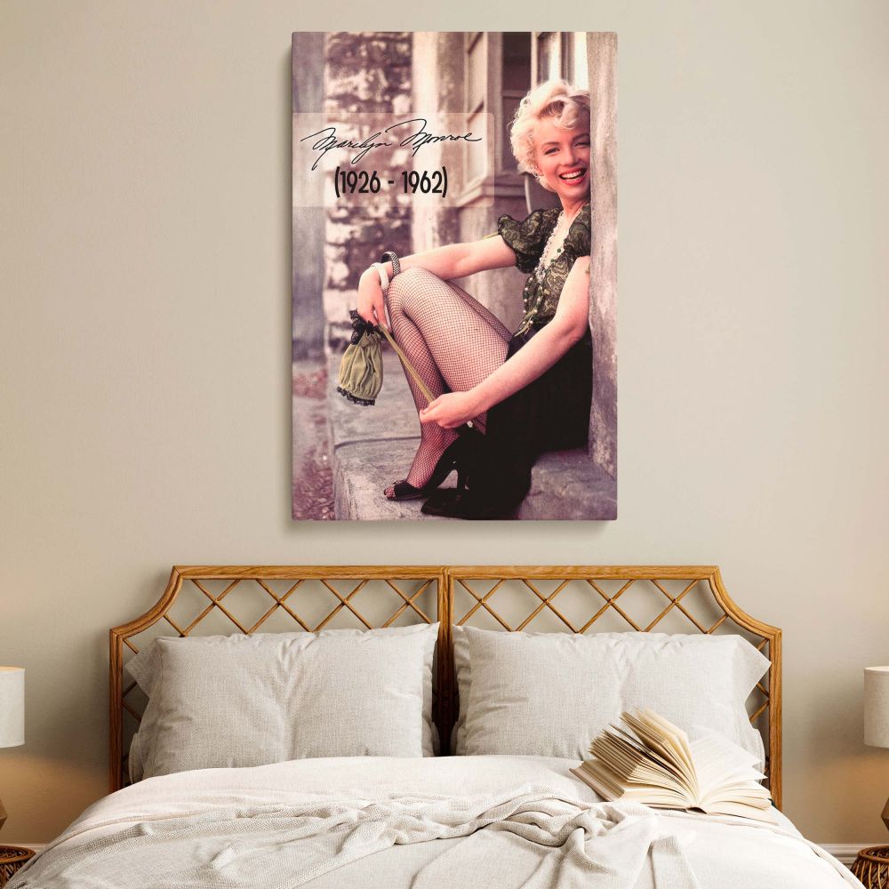 Iconic Marilyn Monroe wall art showing her in a 1956 photo wearing a puff sleeve lace top fishnet stockings and heels perfect for bedroom wall decor.
