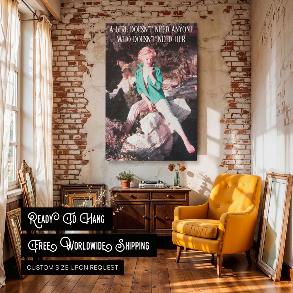 Timeless wall art of Marilyn Monroe lounging on stone in striped capri pants and bold green shirt accompanied by the quote a girl doesn't need anyone who doesn't need her blending retro photography and feminist inspiration for vintage-loving interiors.
