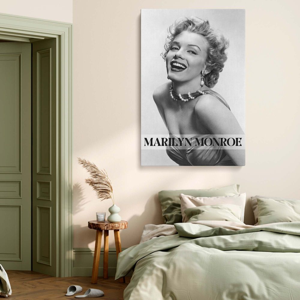 Black and white image of Marilyn Monroe in radiant smile and glamorous pearls perfect for vintage photography prints and retro wall styling in elegant personal spaces.