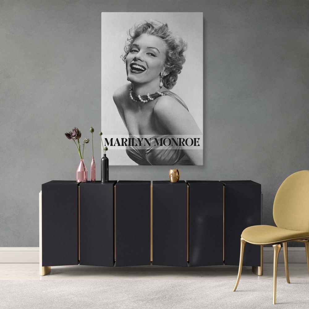 Classic Marilyn Monroe canvas wall art showing her in iconic laughing pose with pearls ideal for film-inspired interiors and vintage Hollywood portrait lovers.