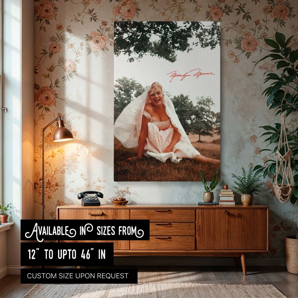 Marilyn Monroe art print featuring her seated in a white lace dress laughing joyfully on the grass with trees in the background perfect for vintage Hollywood decor retro fashion wall styling and fans of classic celebrity portraits looking for glamorous fe