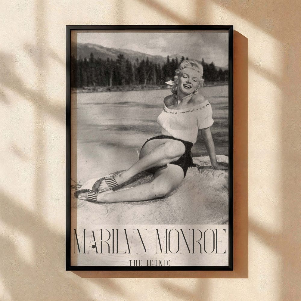Marilyn Monroe wall decor in retro black and white showing her relaxed on a lakeside rock in a playful summer outfit combines nature with Old Hollywood style for vintage film fans seeking classic photography of the glamour icon in peaceful outdoor moments