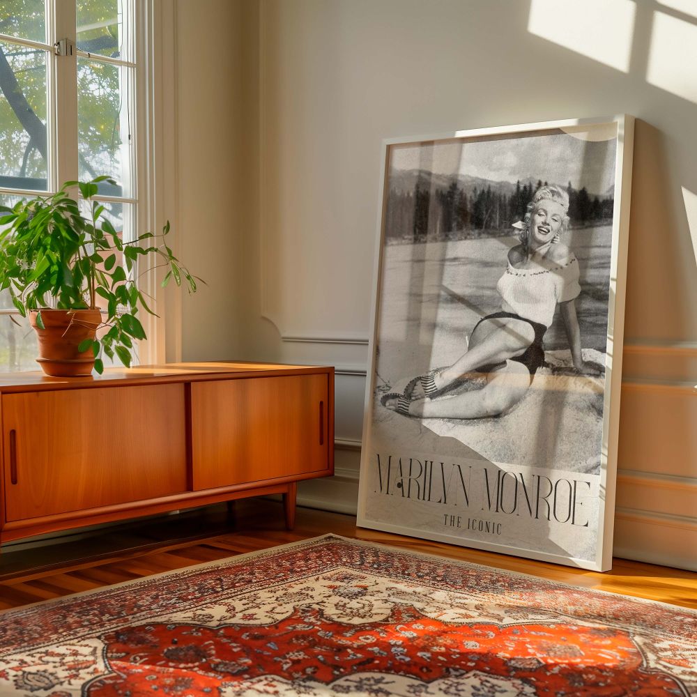 Glamorous vintage photo print of Marilyn Monroe sitting by a lake with natural background and radiant smile highlights her timeless appeal in black and white great for home theater walls or gifts for retro film fans and Monroe collectors alike.