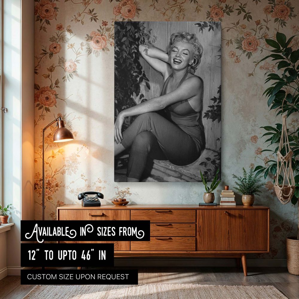 Marilyn Monroe laughs freely in a stunning black and white photograph while wearing a red halter jumpsuit this vintage image captures the glamour and charm of Hollywood's golden era perfect for fans of iconic actress wall art retro decor and timeless phot