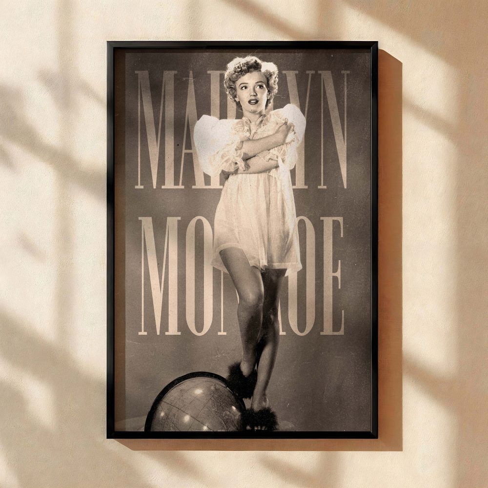 Black and white photo print of Marilyn Monroe in a sheer nightgown posing confidently with one leg resting on a globe symbolizing her global stardom and legendary beauty this image is a standout piece of vintage wall decor for fans of 1950s Hollywood.