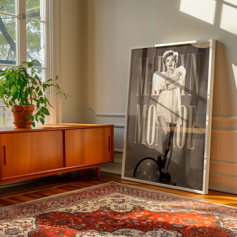 Monroe art print with vintage glamour showcasing Marilyn in a sheer nightgown standing on a globe in a playful and confident pose this black and white Hollywood image brings retro flair to your room with timeless celebrity elegance.