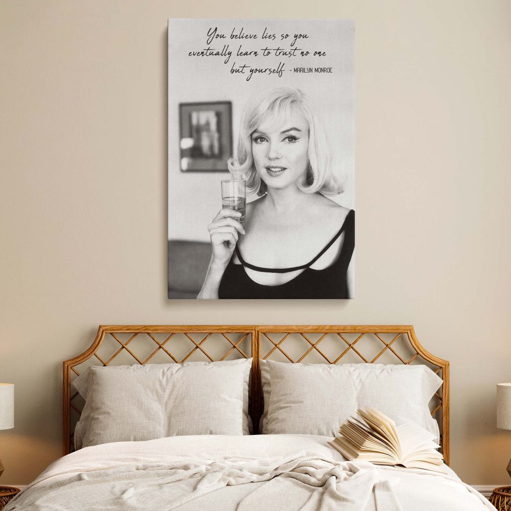 This Marilyn Monroe quote poster features a bold black and white photograph of her holding a glass paired with inspiring text for retro actress decor and vintage Hollywood print fans seeking empowering wall art with classic elegance.