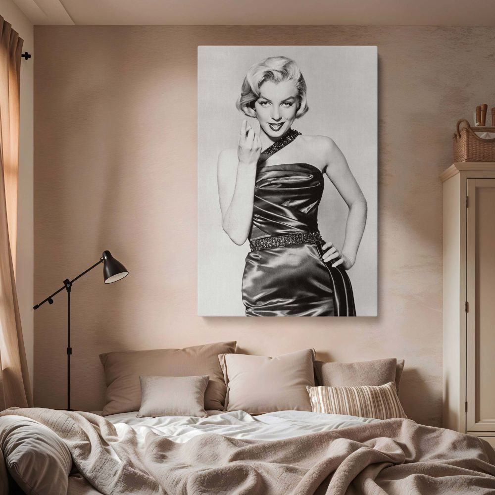 Elegant full-body black and white image of Marilyn Monroe in a fitted satin gown and playful pose ideal for vintage Hollywood canvas print and classic fashion photo displays in retro actress wall art collections or glamorous gallery settings.