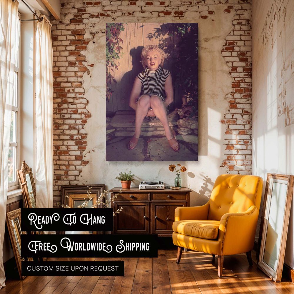 Vintage Marilyn Monroe portrait featuring her seated in a relaxed pose with folded legs and a striped turtleneck dress this calm and intimate photograph offers a glimpse into the softer side of the Hollywood icon and is ideal for collectors of 1950s retro