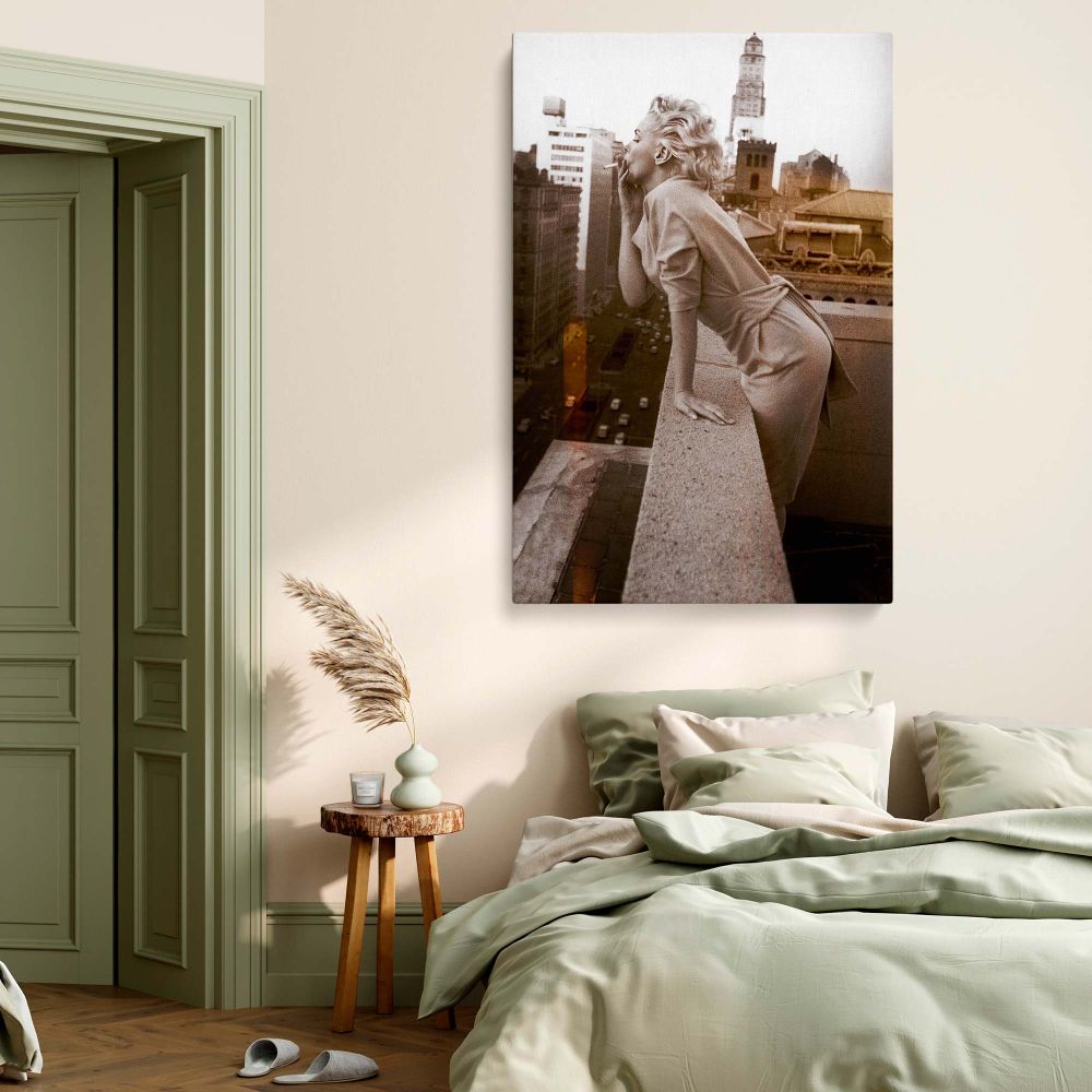 Iconic rooftop image of Marilyn Monroe mid-blow kiss with vintage skyline perfect for canvas and retro decor.