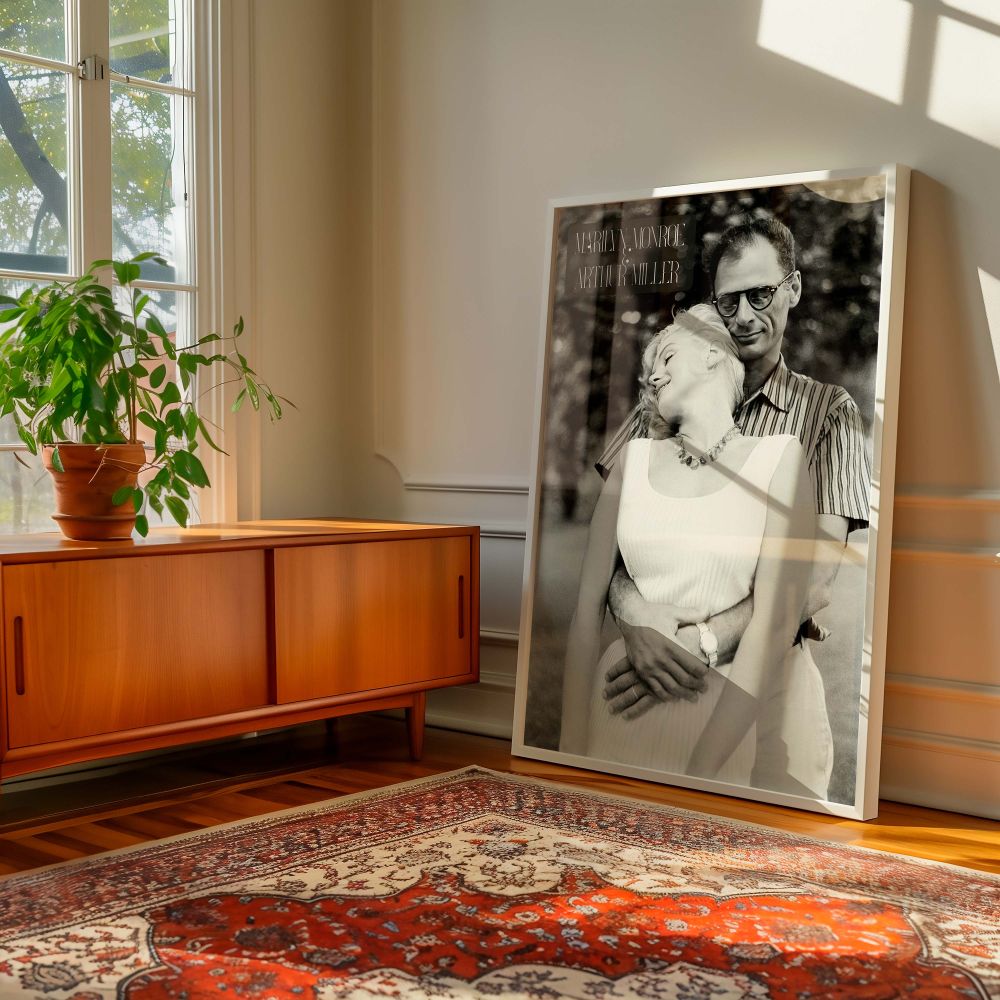 Wall art showing Marilyn Monroe wearing a white dress with her head leaned into Arthur Miller in a peaceful embrace ideal for retro decor romantic wall prints and vintage photography lovers seeking old Hollywood sentimentality.