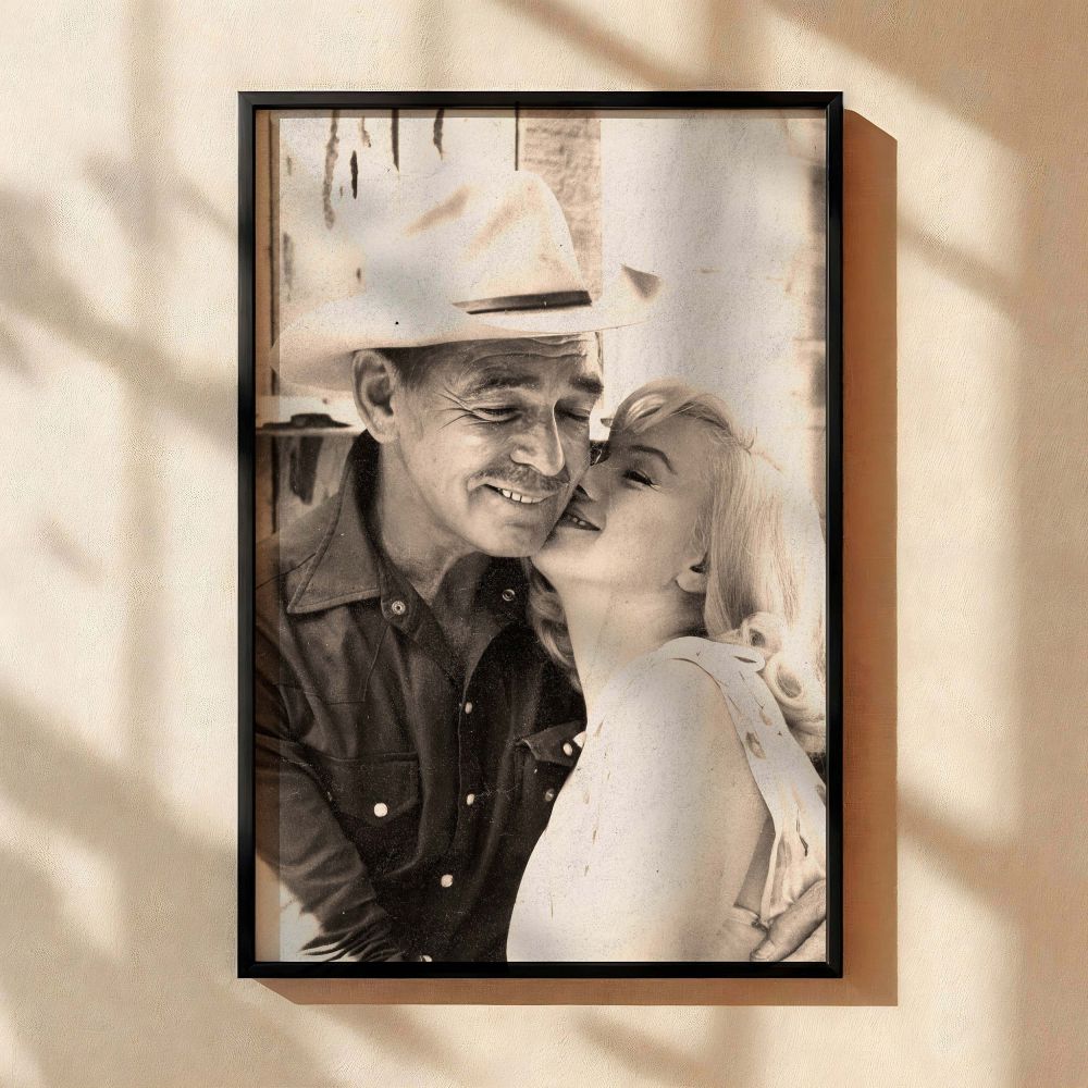 Romantic black and white photo of Marilyn Monroe resting against a man wearing a cowboy hat a tender moment frozen in time perfect for vintage Hollywood enthusiasts and retro-inspired wall decor Monroe's expressive eyes and classic beauty create a cinemat
