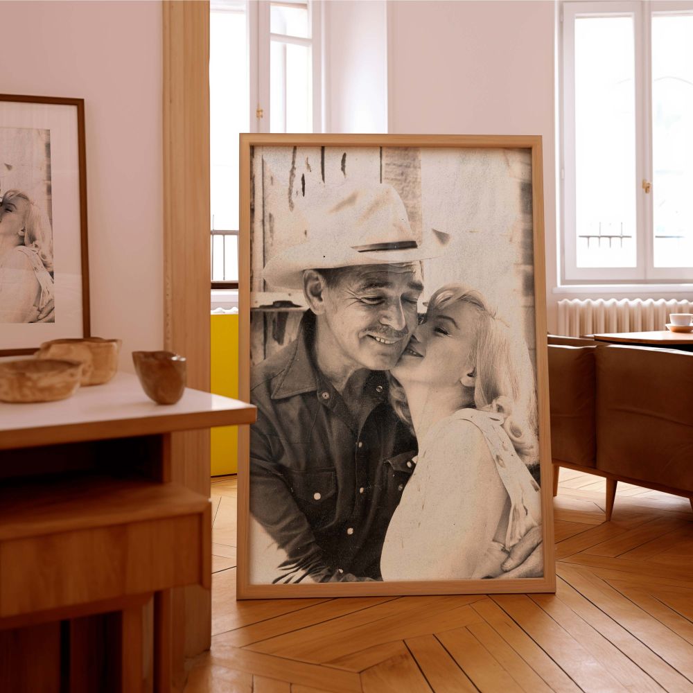 Marilyn Monroe vintage wall art featuring a touching embrace with a man in a cowboy hat perfect for fans of romantic black and white photography this print celebrates the golden age of Hollywood and adds a nostalgic flair to retro-inspired interiors.