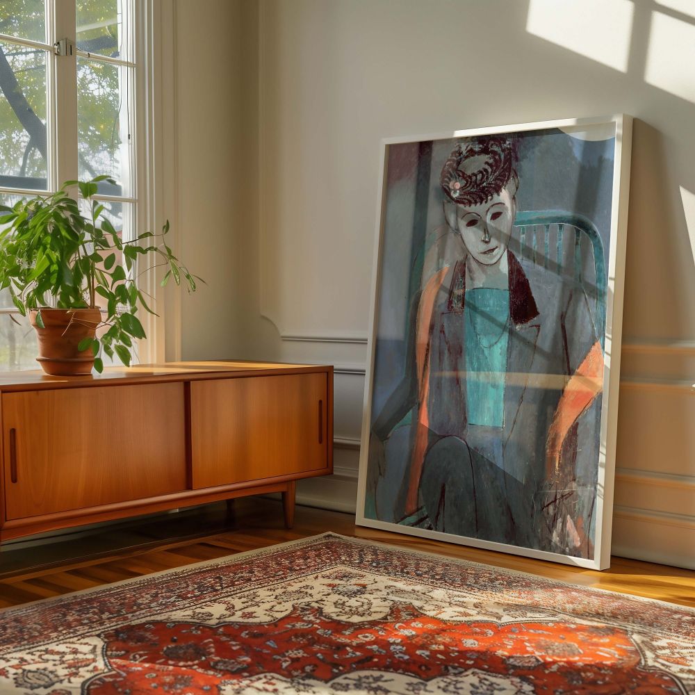 This expressive wall canvas print of Henri Matisse's portrait of his wife offers a rich mix of deep aquas, burnt orange, and black detailing. The figure's composed expression and abstracted seat capture both character and artistic stylization. With its vi