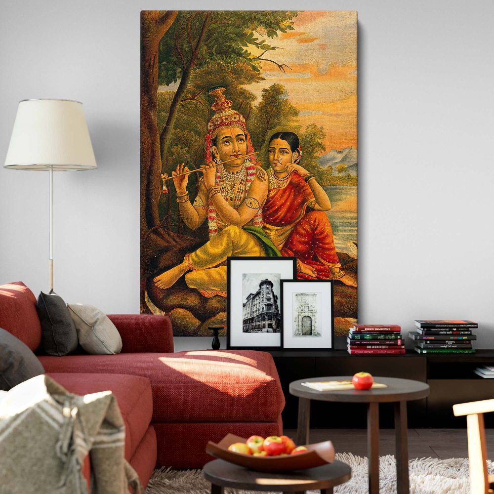 Traditional Indian canvas art showing Radha listening to Krishna playing the flute by a peaceful shoreline, surrounded by lush trees and a glowing sunset, symbolizing their divine love and harmony in vibrant and intricate artistic detail.