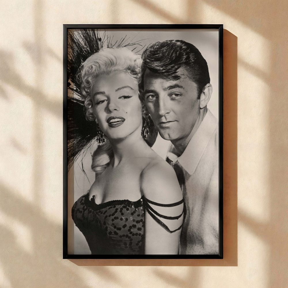 Vintage movie still printed on canvas showing Marilyn Monroe and Robert Mitchum in River of No Return perfect for Hollywood decor lovers and fans of black and white glamour photography who admire iconic moments in cinematic history.