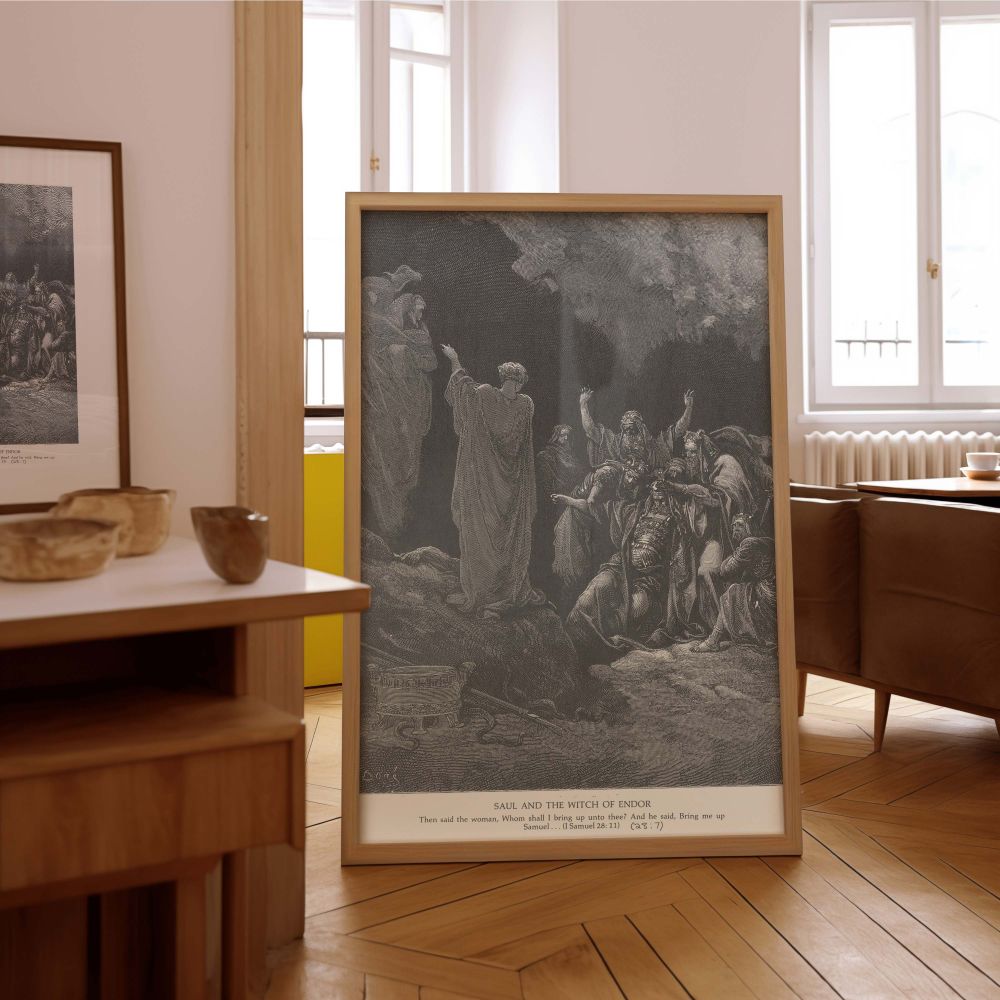 This grayscale canvas wall art shows the ghost of Samuel rising as Saul consults the forbidden witch at Endor, drawn by Gustave Dore. The figures gather in a cave setting, cloaked in mystery and divine presence. Saul collapses in despair, and the witch ge