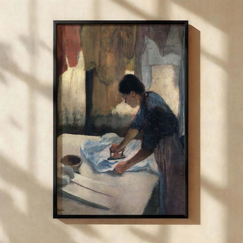 Impressionist canvas print of Woman Ironing by Degas showcasing a hardworking woman pressing linens under diffused daylight. Her attire in blue and pink, along with the surrounding fabric textures, creates a feeling of quiet dedication and everyday ritual
