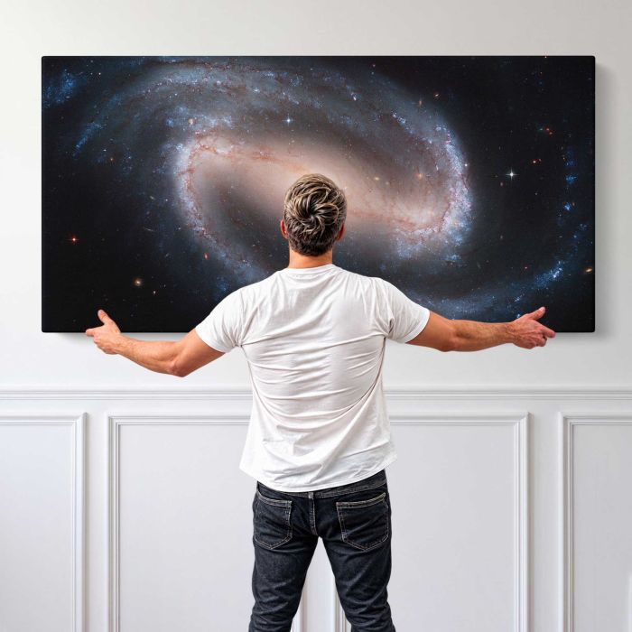 Barred Spiral Galaxy NGC 1300 canvas print, canvas shown with a person for scale