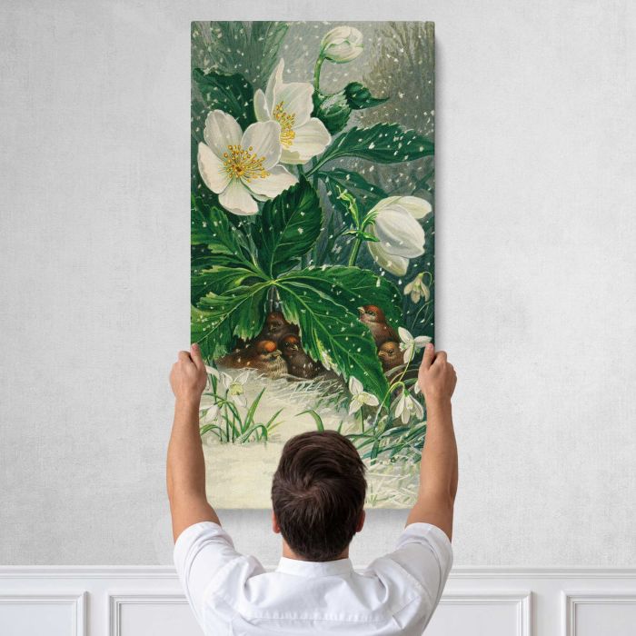 Birds beneath white flowers in winter canvas print, tall canvas held against a wall