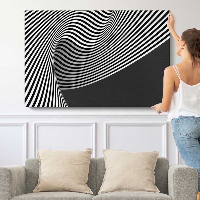 Black and White Abstract Lines canvas print, canvas shown with a person for scale